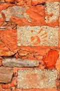 Closeup of a wall constructed with ochre mortar: Photo Copyright Marcia M. Mueller