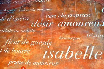French names of ochre pigments made at the Matthieu Ochre Works in Roussillon handwritten on an ochre wall: Photo Copyright Marcia M. Mueller