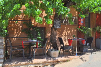 A sidewalk cafe in Roussillon: Photo Copyright Marcia M. Mueller 